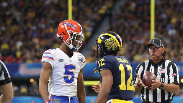 Dec 29, 2018; Atlanta, GA, USA; Florida Gators defensive back CJ Henderson (5) reacts after tackling Michigan Wolverines running back Chris Evans (12) in the first quarter of the 2018 Peach Bowl at Mercedes-Benz Stadium.